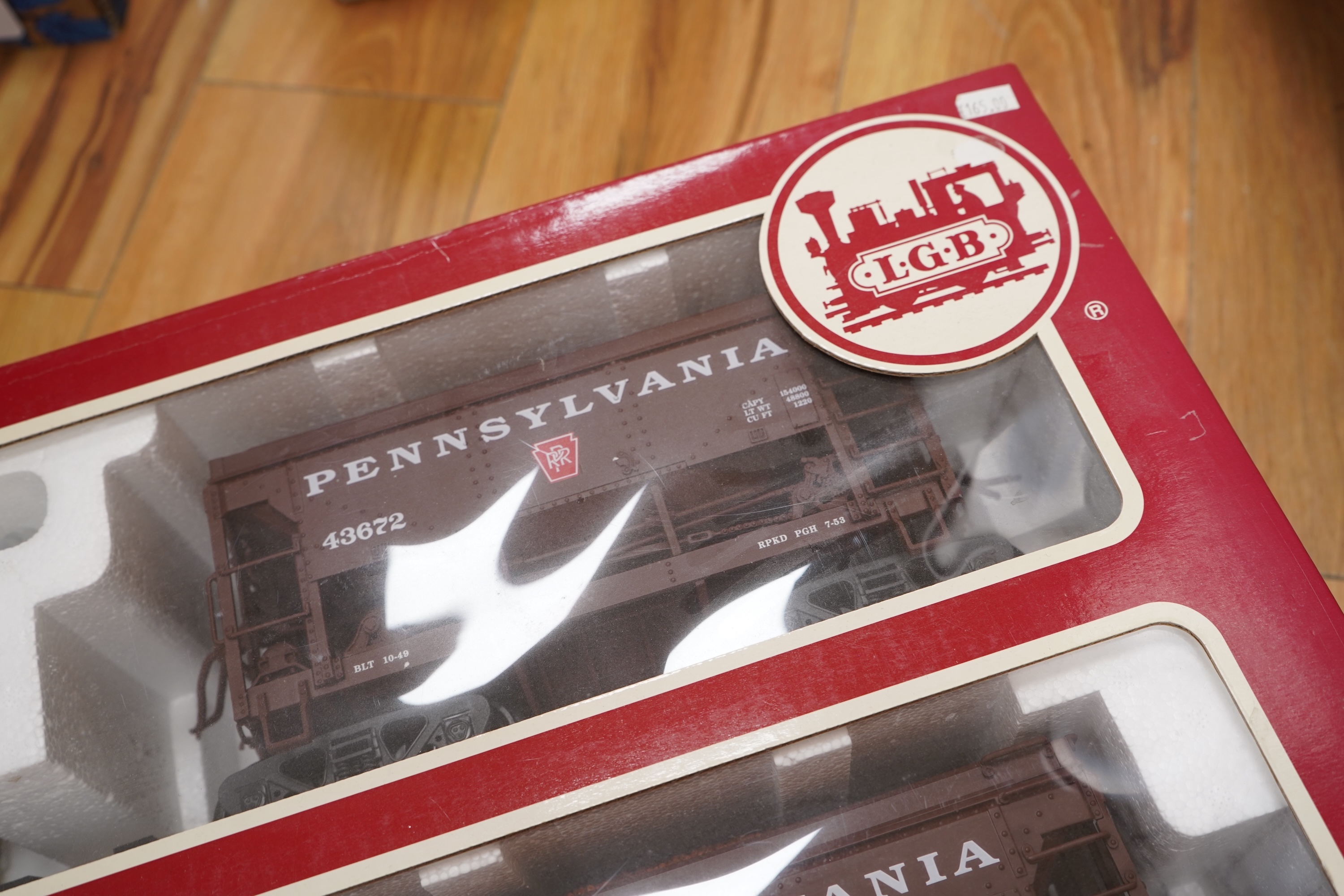 A boxed G scale (45mm) LGB set of four hopper wagons (40045). Condition - good.